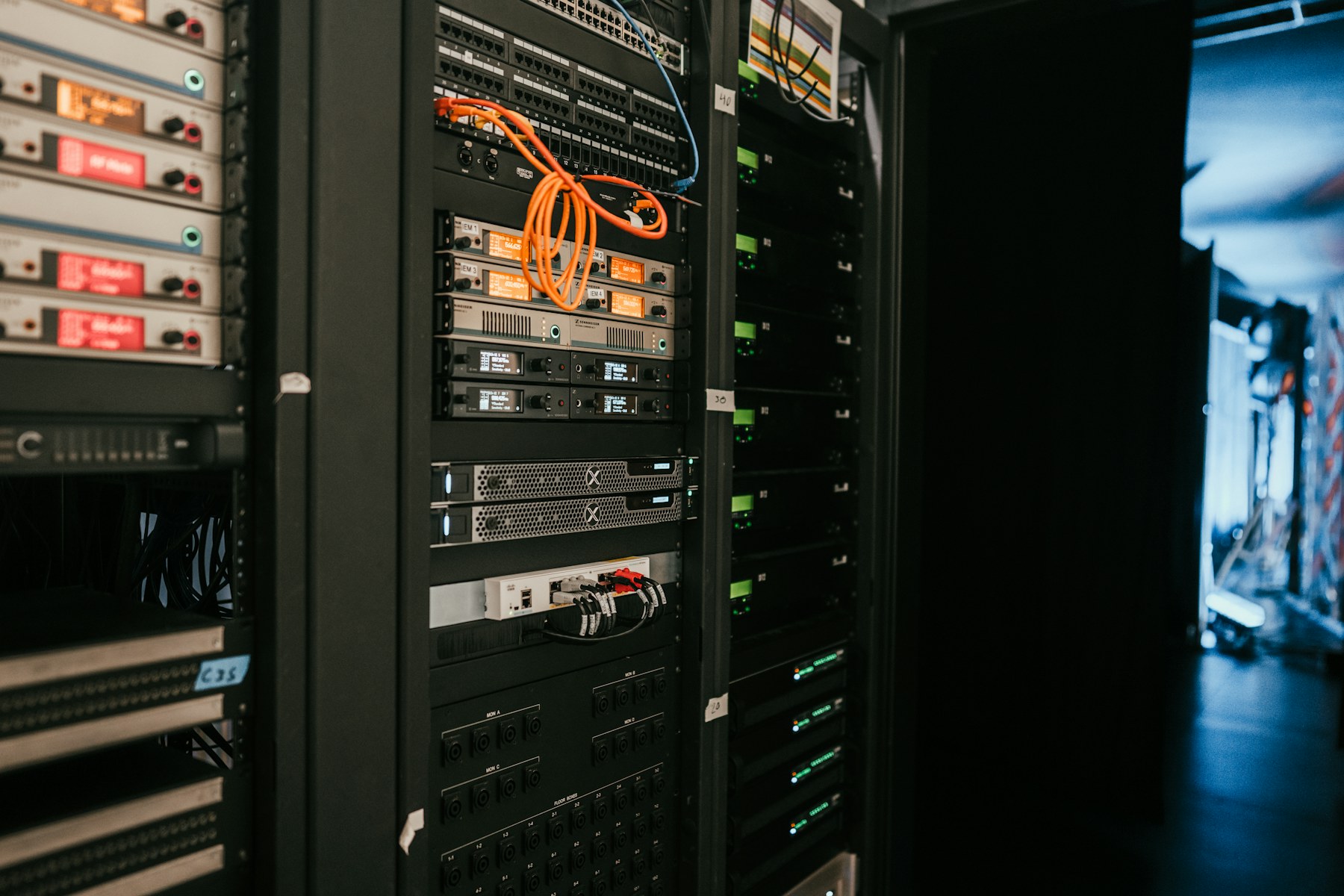 Server racks and network infrastructure representing the global AI capital-expenditure cycle